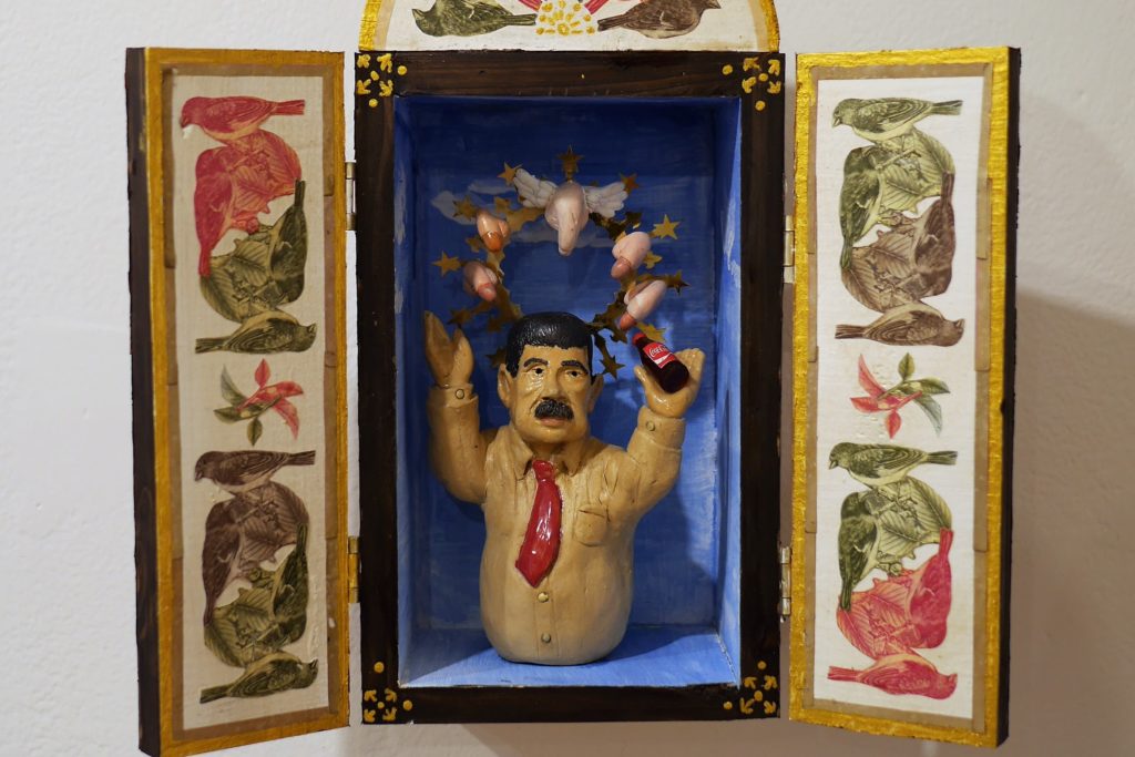 The 'dick-tator'?  Maduro with flying penises in retablo-style art by Andrés Chaparro. Photo: Steve Hide. 