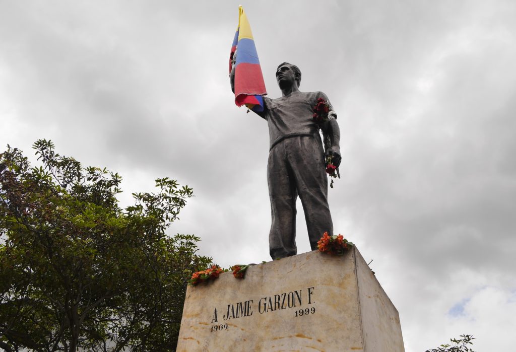 His statue close to Corferias. On the 20th anniversary of the murder many people visited the monument, took pictures, left flowers and gave him a flag. Photo: Steve Hide