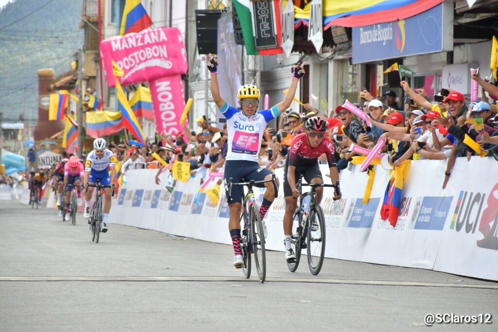 Higuita passing the finish line ahead of Egan Bernal. 