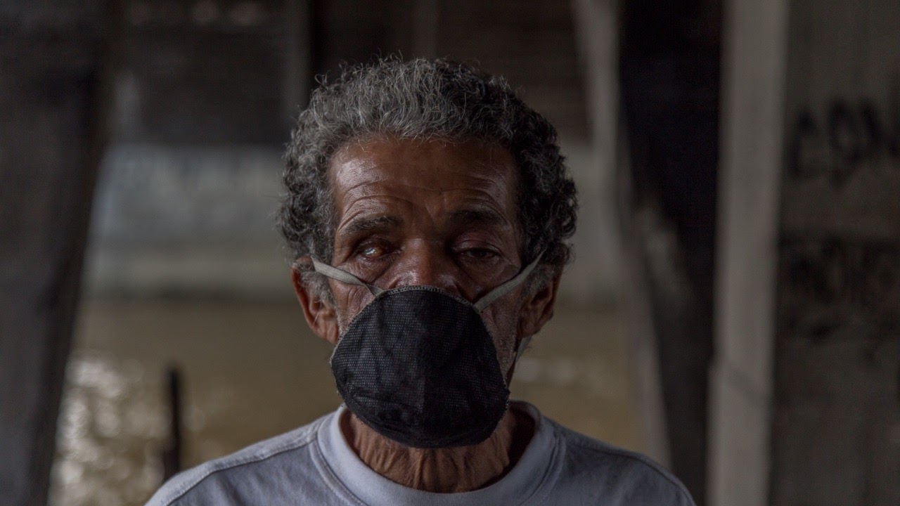 Marco Aguirre, one of Medellín's homeless, in a face mask