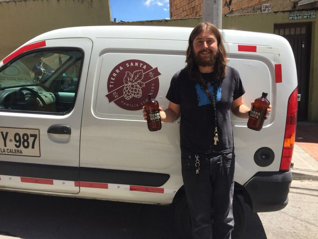 Tierra Santa brewer Julian Salamanca in front of his delivery van. 