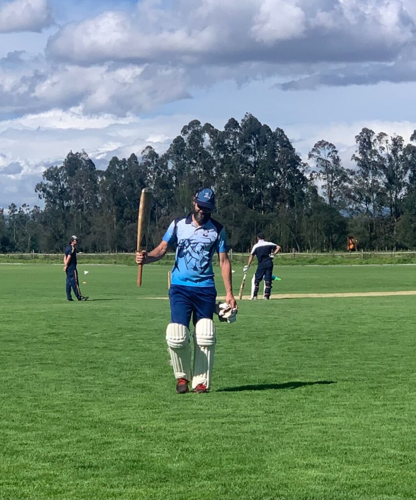 Andy Farrington walking off pitch after a 55 run stand for article on Colombian cricket. Photo courtesy of Christopher Price.