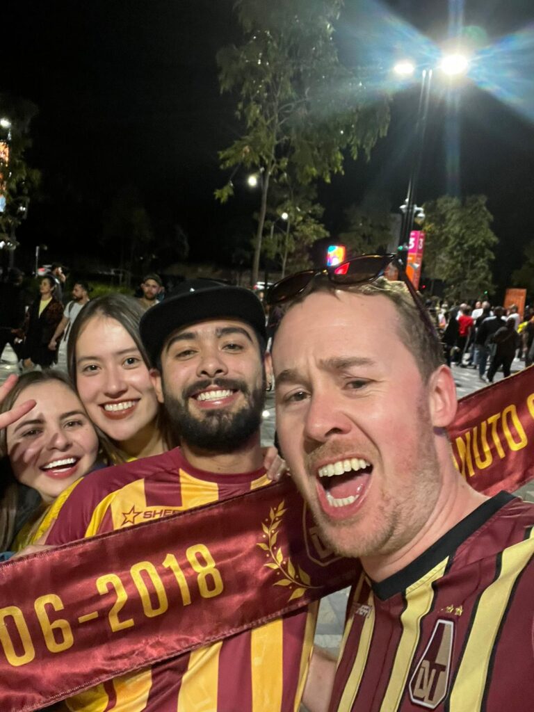 A grinning Aussie (Tristan Quigley) as part of the Deportes Tolima Ultras on tour