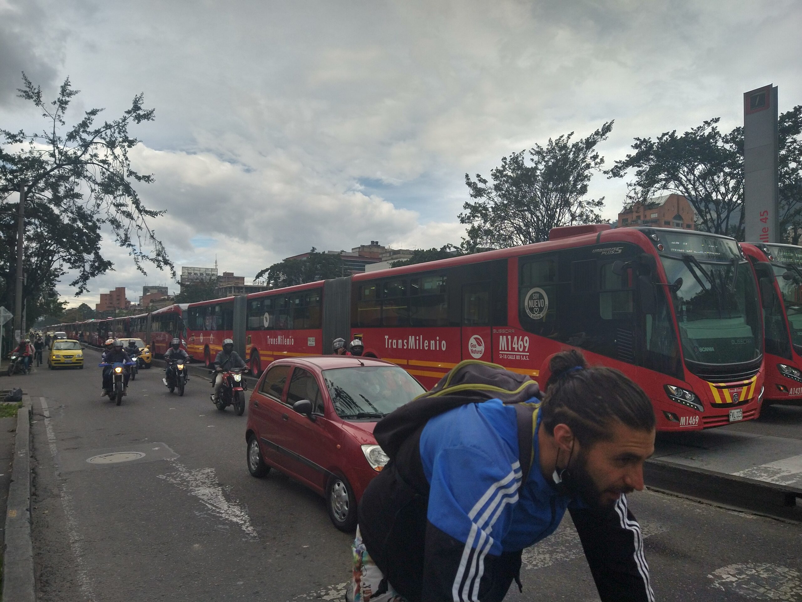 Various types of transport in Bogotá together on a street