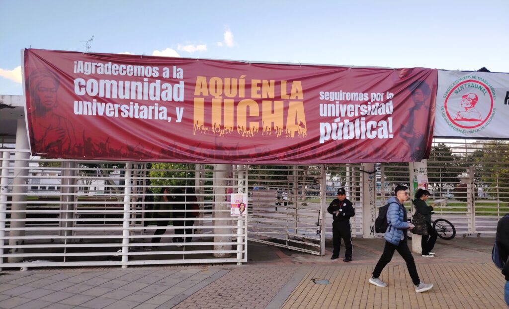 "Here in the battle": protesters draped the university with posters this week. Photo: Steve Hide