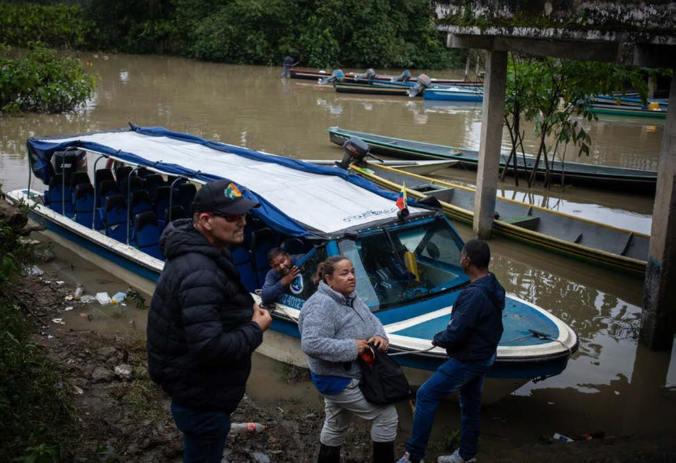 Jani Silva with her bodyguards in La Perla reserve, Putumayo. Photo: Courtesy Global Witness