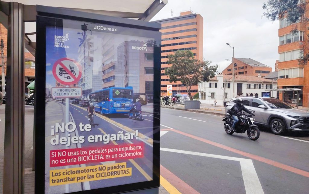 "Don't let them fool you": Bogotá's mobility secretariat has been trying to ban e-motos from bike lanes but with little impact. Photo: S. Hide.
